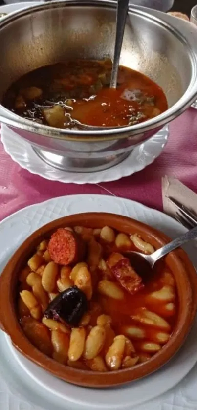 Spanish bean stew with chorizo served in a rustic bowl.