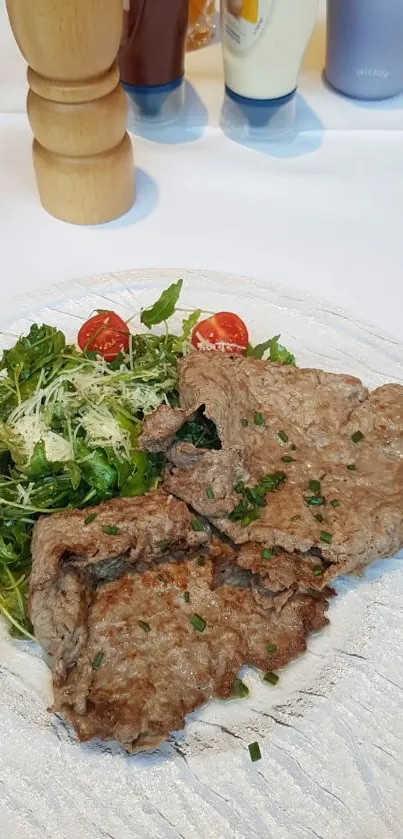 Plate of steak and salad for phone wallpaper.