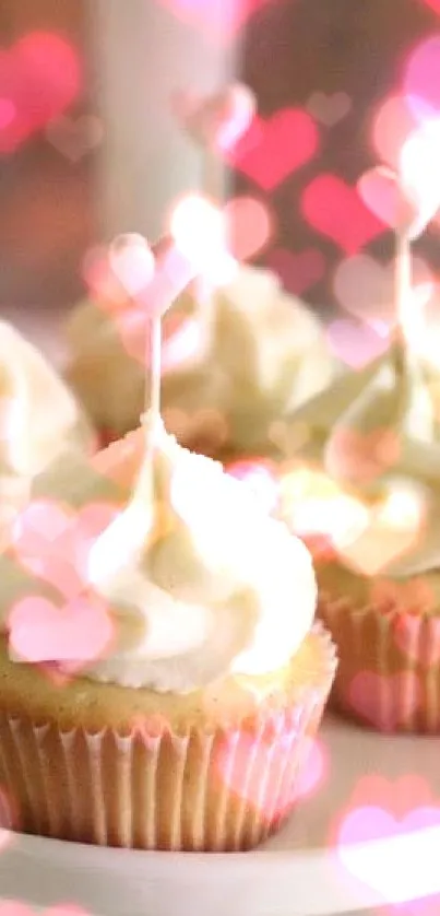 Vanilla cupcakes with creamy frosting and heart-shaped toppers.