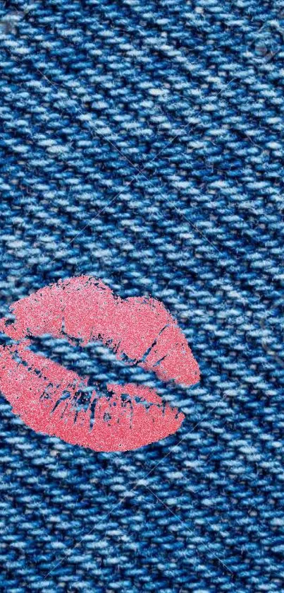 Stylish denim texture wallpaper with a pink lip print, ideal for trendy phone backgrounds.