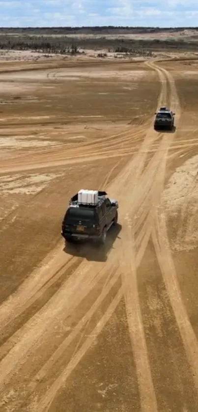 4x4 vehicles on a sandy desert trail, capturing an adventurous off-road journey.