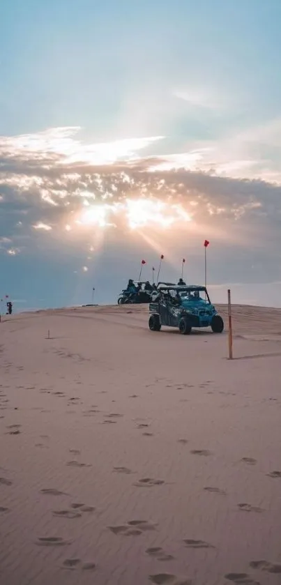 ATVs traversing desert dunes during sunset with a cloudy sky.