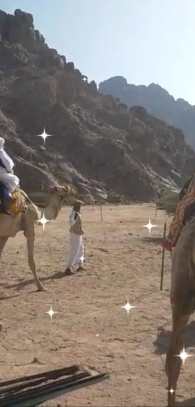 Camels and riders in a desert landscape.