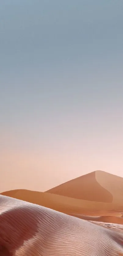 Serene desert dunes under a calming sky.