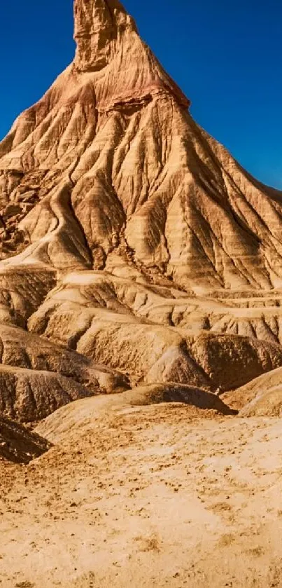 Desert rock formation with clear blue sky in mobile wallpaper.