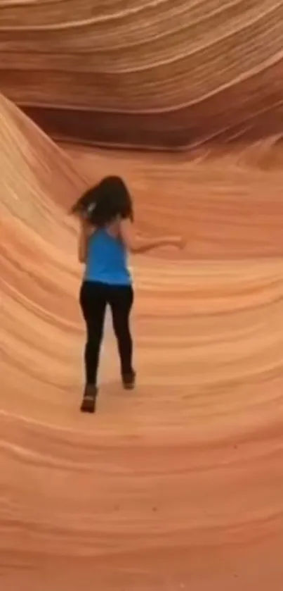 Woman exploring vibrant sandstone desert landscape.