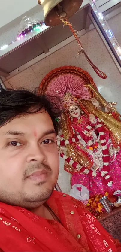 Devotional shrine with deity statue in vibrant colors.