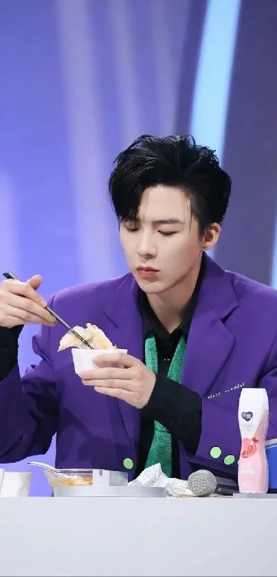 Person enjoying a meal in a vibrant purple-themed setting.