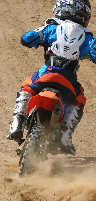 Dirt bike racing through dusty terrain in motocross action scene.