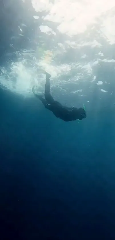 Mobile wallpaper of a diver in deep blue ocean.