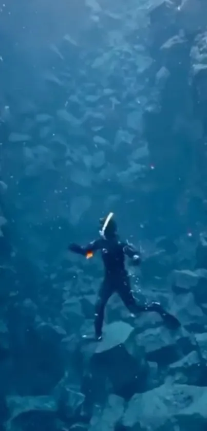 Diver exploring deep oceanic abyss with rocky underwater scenery.