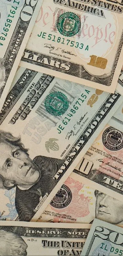 Assorted US dollar bills forming a colorful and intricate pattern.