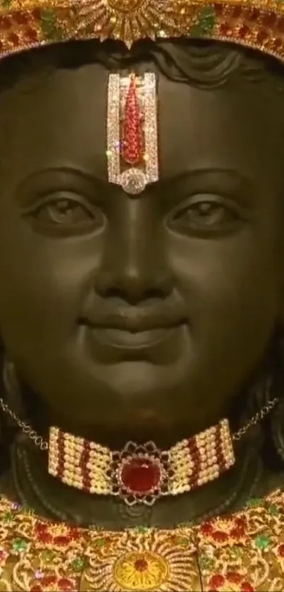 Majestic black stone deity with gold jewelry close-up.