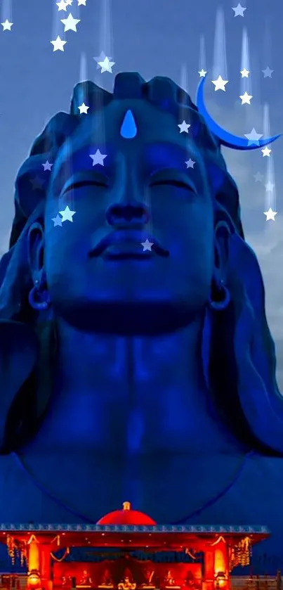 Divine blue Shiva statue under a starry night sky.