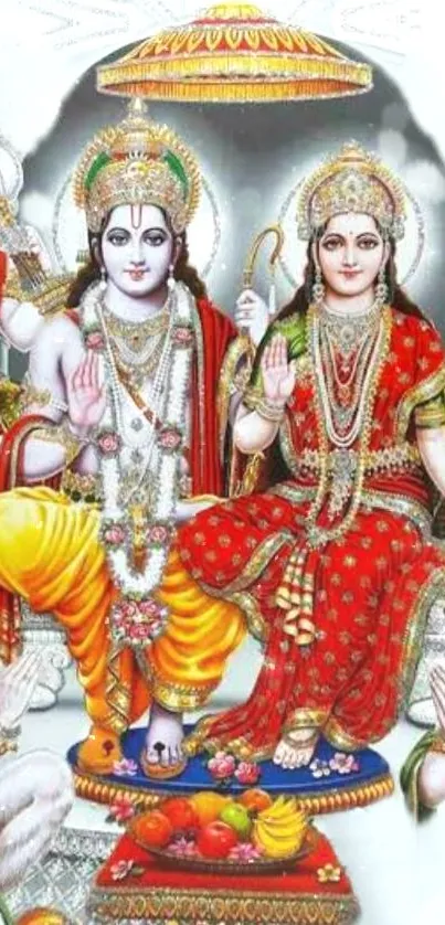 Vibrant mobile wallpaper with divine deities in red and gold attire.