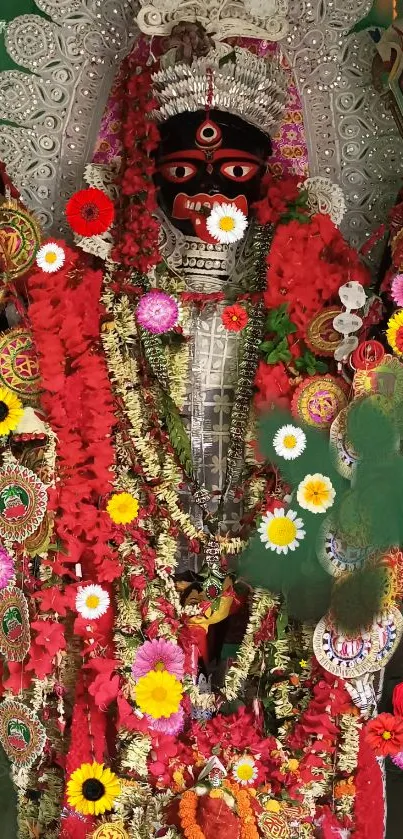 Hindu deity adorned with vibrant flowers and traditional decorations.