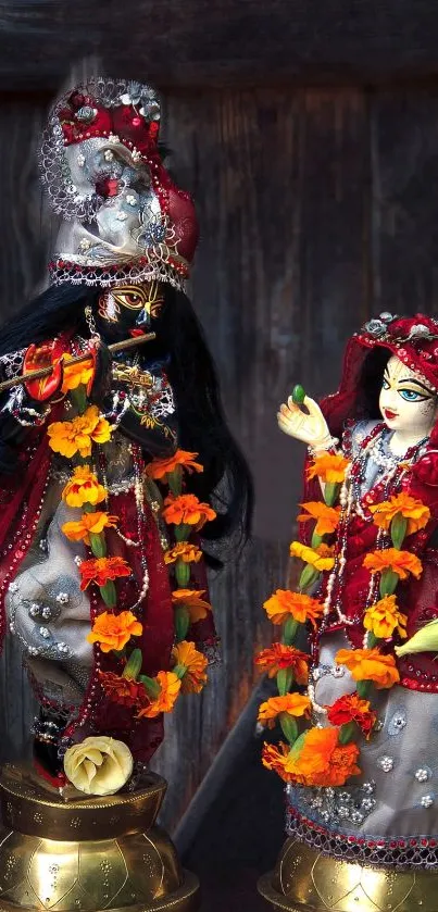 Divine figurines with floral decor in a rustic setting.