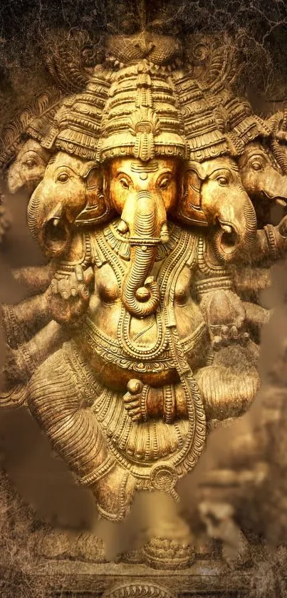 Golden Ganesha art with intricate design.