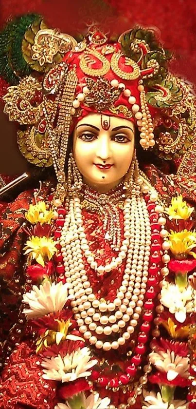 Goddess adorned in red with floral and gold decorations.