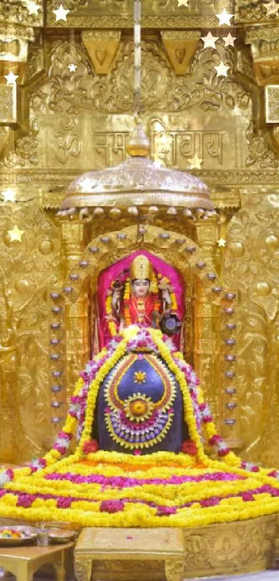 Golden shrine with vibrant floral garlands and sacred decor.