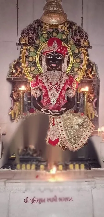 Divine idol beautifully adorned in temple setting with intricate details.