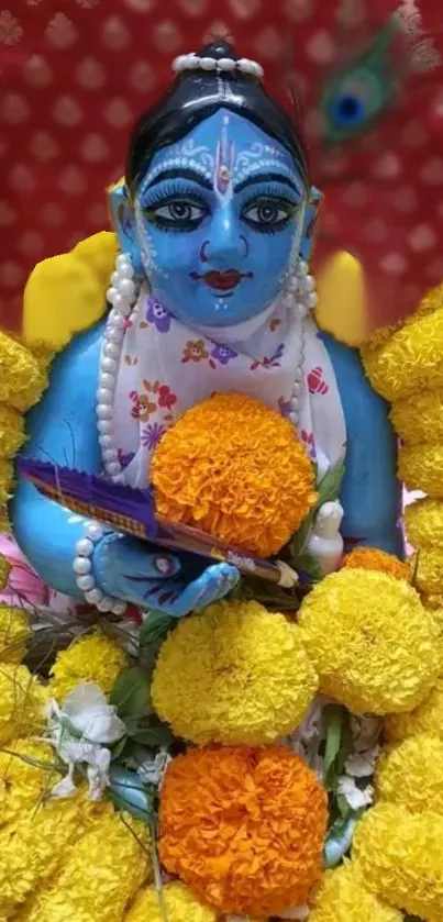 Vibrant blue Krishna idol adorned with yellow flowers, perfect for mobile wallpaper.