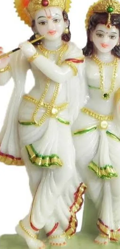 Radha and Krishna statue in traditional attire.