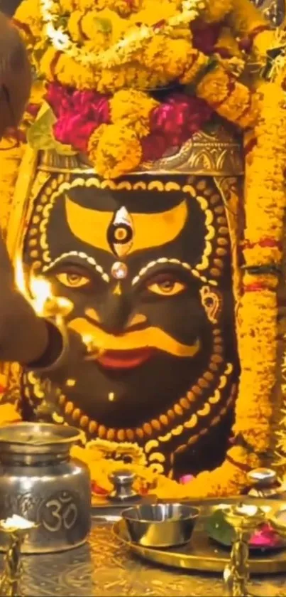 Hindu ritual with deity and floral garlands in Varanasi.