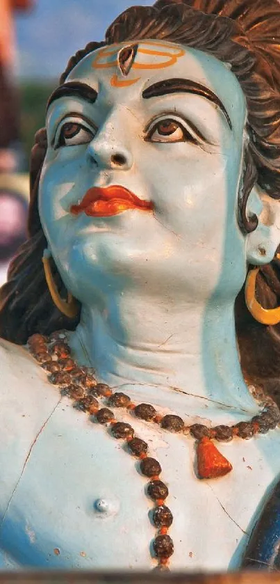 Vibrant statue of Shiva with intricate details and colorful backdrop.