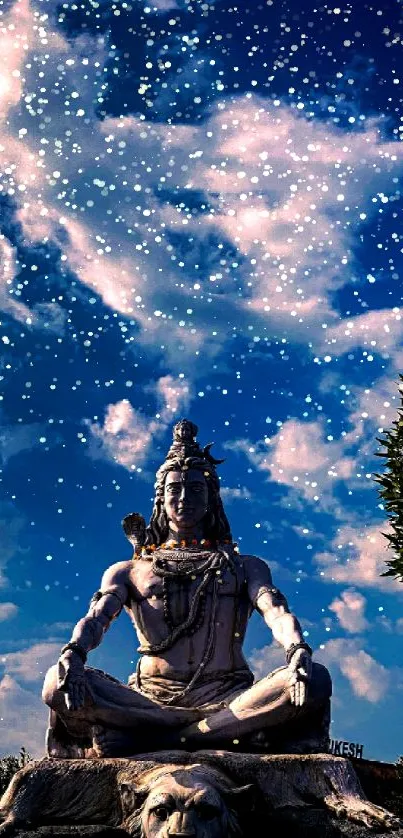 Lord Shiva statue meditating beneath cloudy blue sky.
