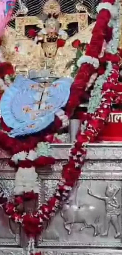 Ornate temple decoration with vibrant garlands and spiritual symbols.