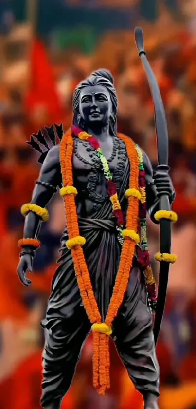 Statue of a divine warrior with garlands against a vibrant red-orange background.