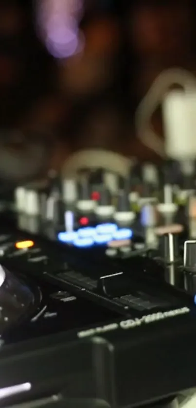 Close-up of a vibrant DJ console with colorful lights.