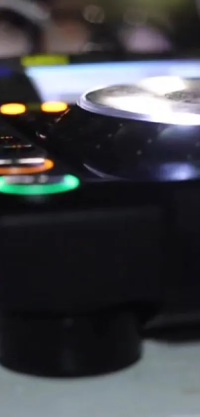 Close-up of DJ equipment with dynamic lights and buttons.