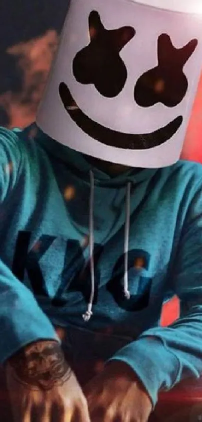 DJ wearing a helmet and teal hoodie in a vibrant setting.