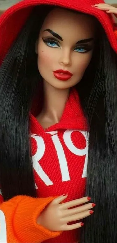 Fashion doll in a red and orange hoodie with a brick background.