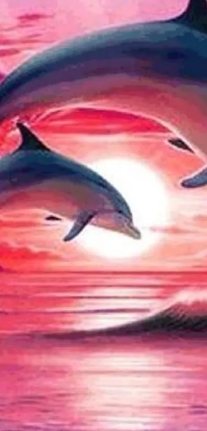 Two dolphins leap in a pink sunset over the ocean.