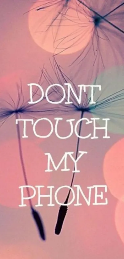 Soft dandelion mobile wallpaper with 'Don't Touch My Phone' text in pastel colors.