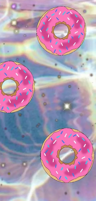 Three pink-sprinkled donuts float in a vibrant galaxy background.