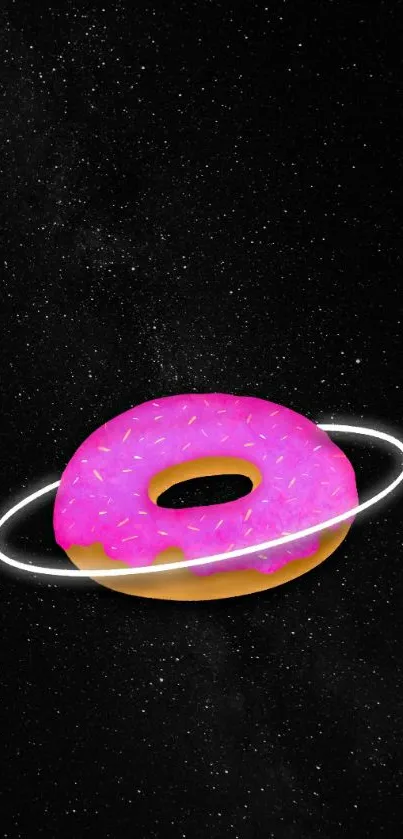 Pink donut orbiting in a starry black sky wallpaper.