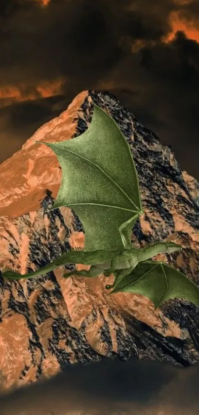 A green dragon soars over a rugged mountain beneath a fiery orange sky.