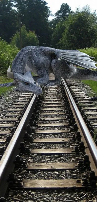 A dragon rests on railroad tracks surrounded by lush greenery.