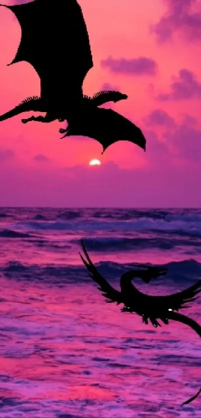 Dragon silhouette over pink ocean sunset scene.