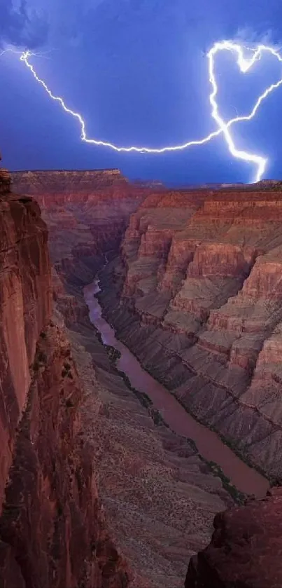 Canyon illuminated by lightning with a heart shape in the sky.