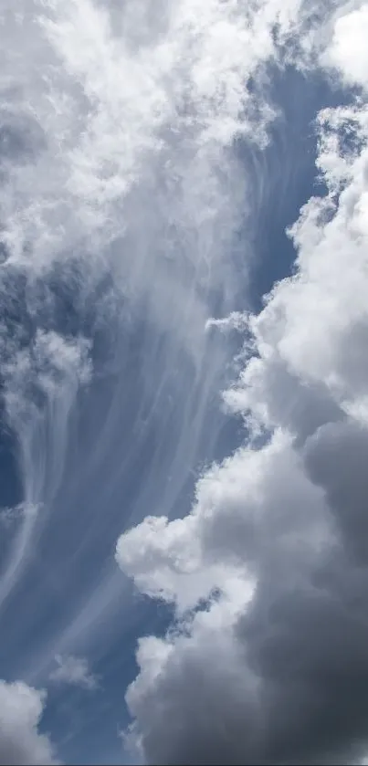 Dramatic cloudy sky wallpaper with deep blue hues.