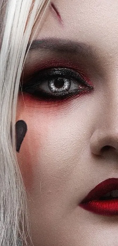 Close-up portrait showcasing dramatic makeup with red lips and smoky eyes.