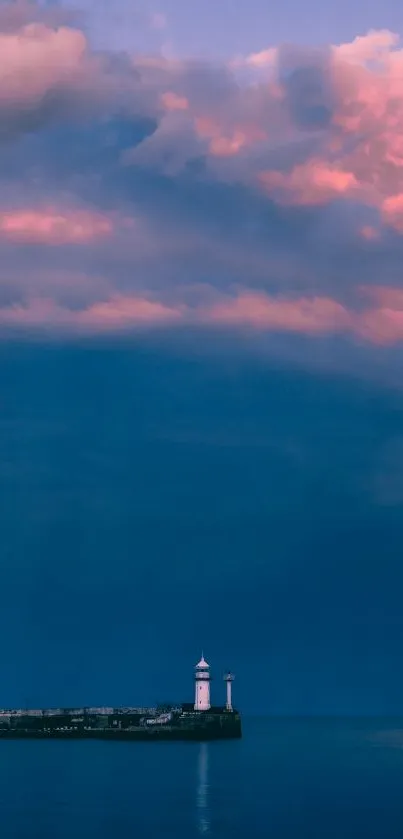 Lighthouse with colorful sunset sky and ocean view.