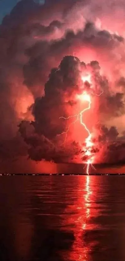 Dramatic lightning in crimson clouds over ocean.