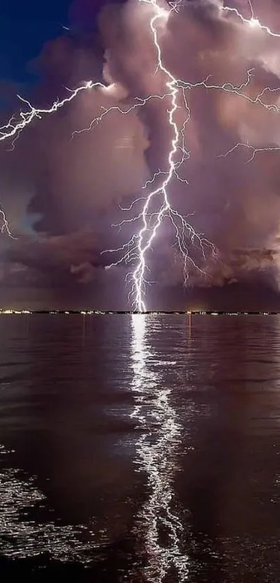 Lightning strikes over water with dramatic clouds.