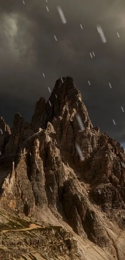 Mountain peaks under stormy dark clouds.